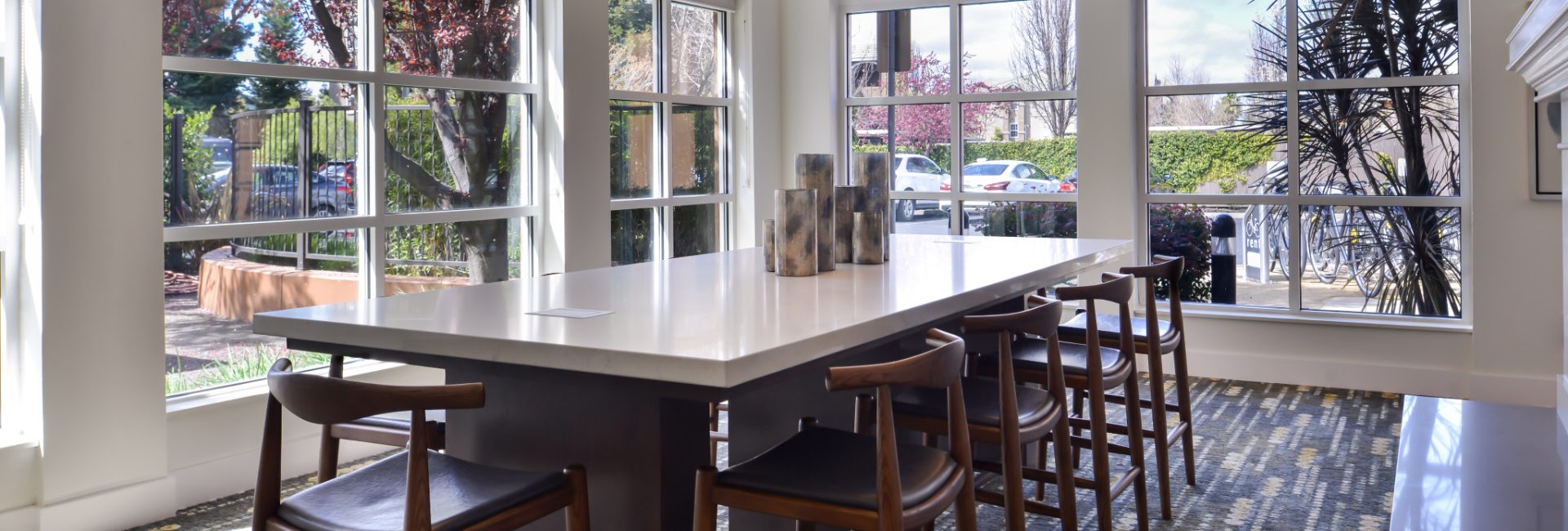 Room with long table and windows